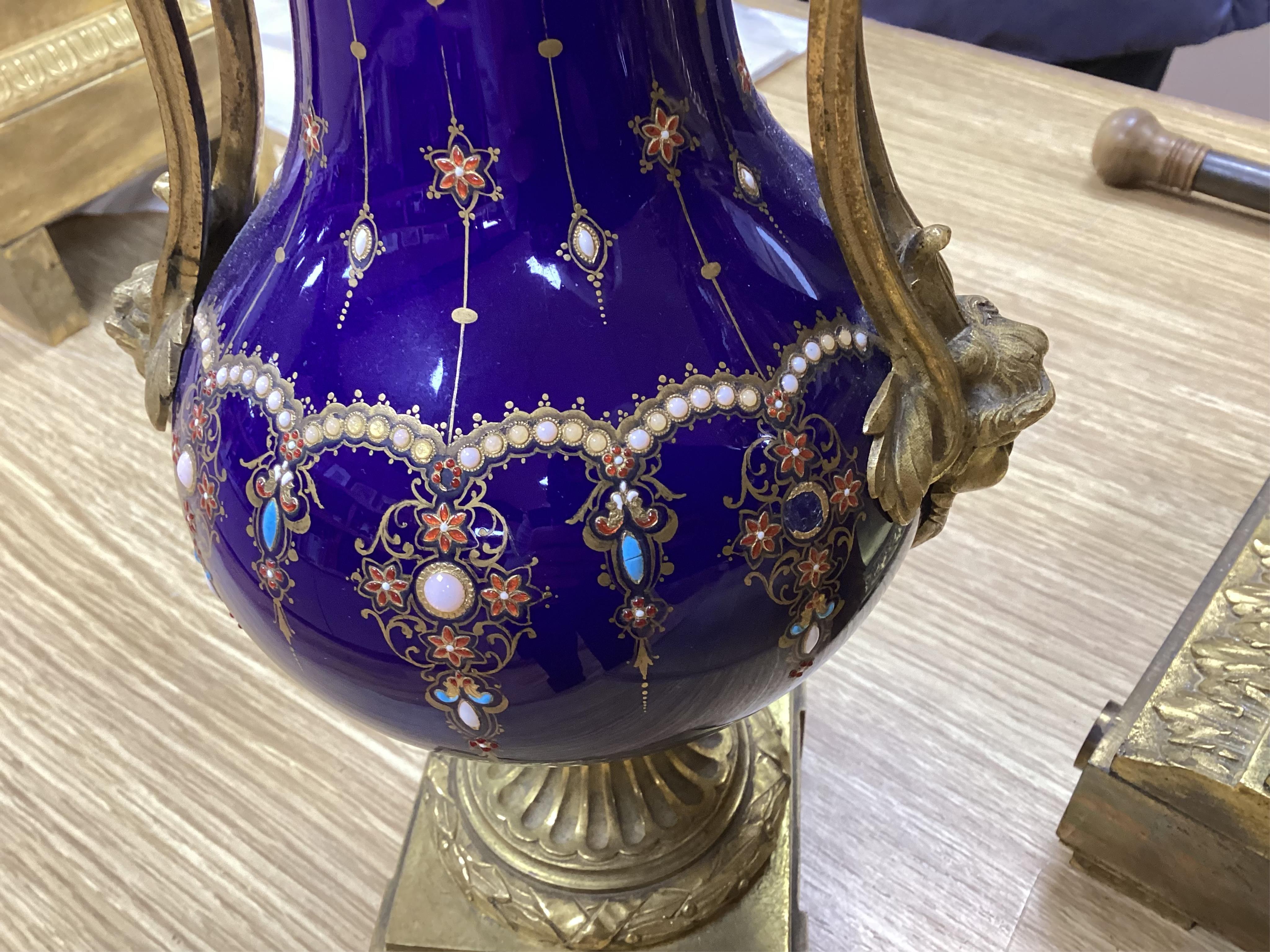 A 19th century Sevres style jewelled porcelain and ormolu matched clock garniture, striking on a bell, with pendulum, 51cm high. Condition - fair to good, minor restoration, untested